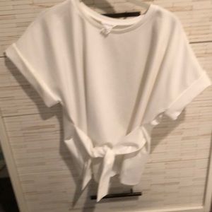 Cream top, tie front cuff sleeves